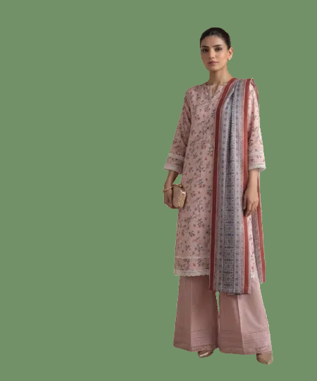 A woman modeling a three-piece traditional outfit consisting of a dusty pink floral kurta, matching wide-leg trousers, and a patterned dupatta with a red border, set against a plain white background.